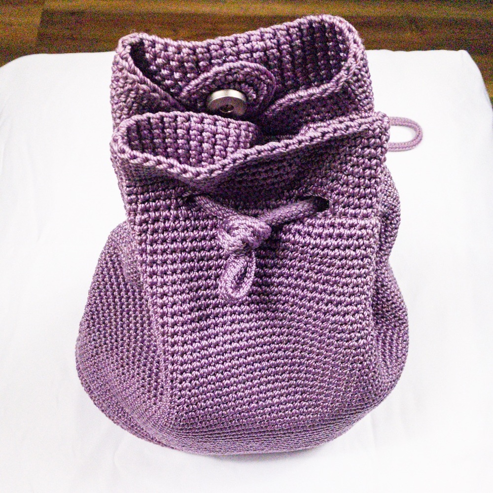 The Sak purple crocheted backpack.